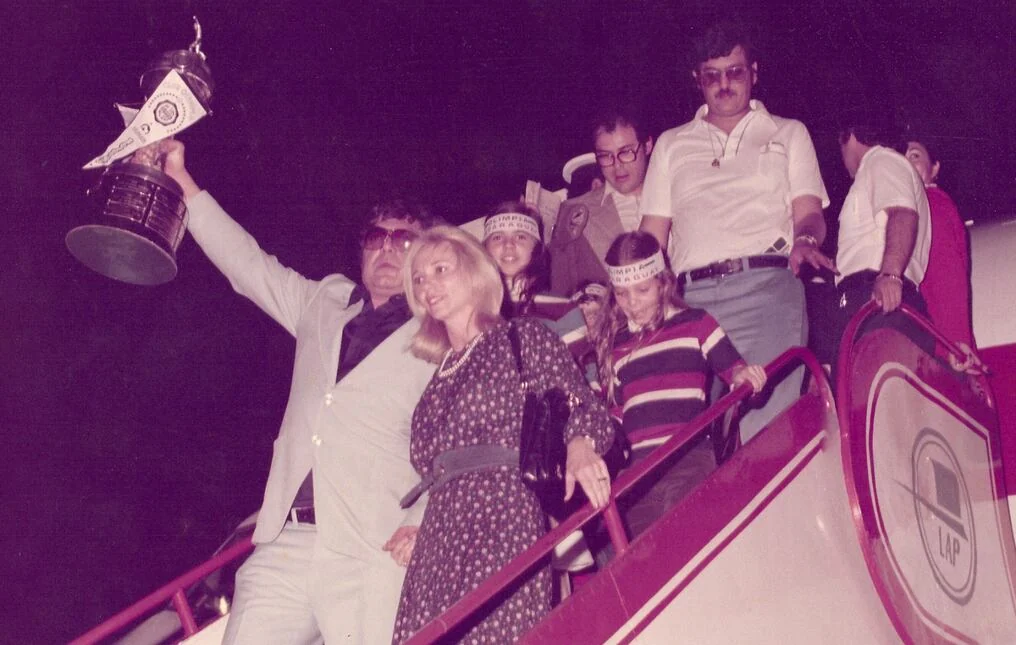 Celebrating with the Copa Libertadores trophy.